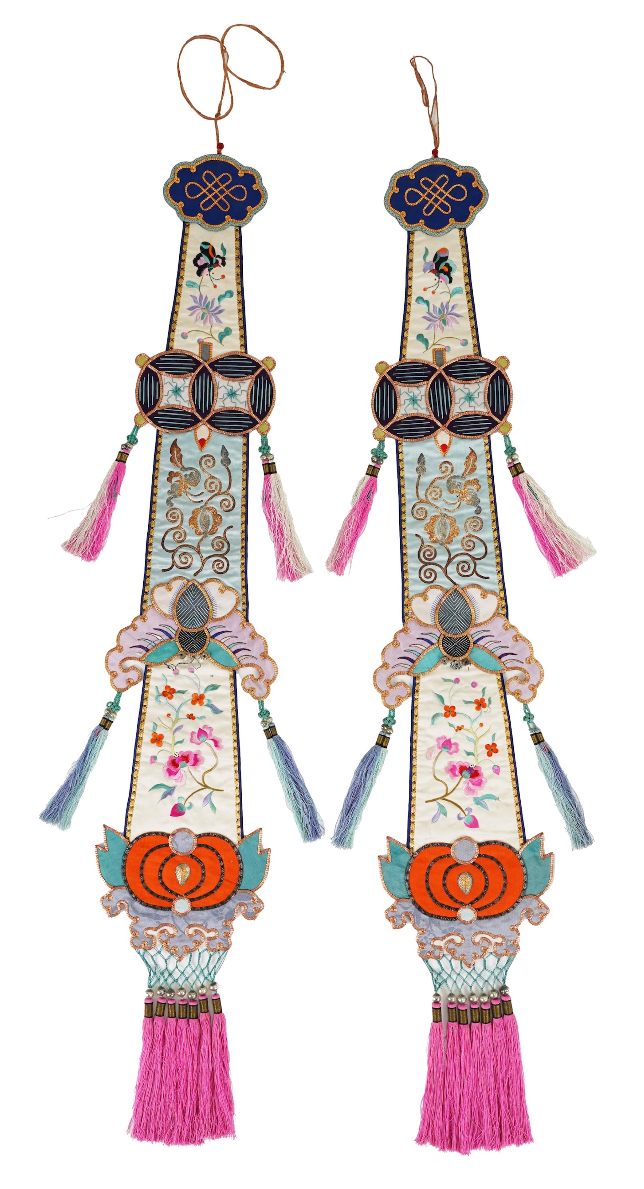A pair of Chinese embroidered silk hanging pendants, early 20th century